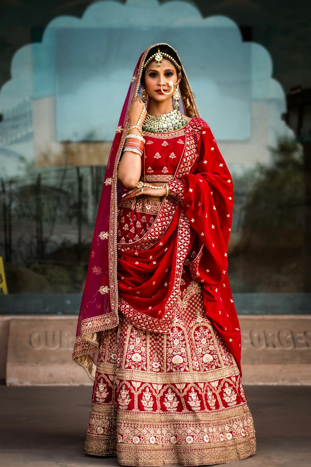 Bride in a red and gold lehenga