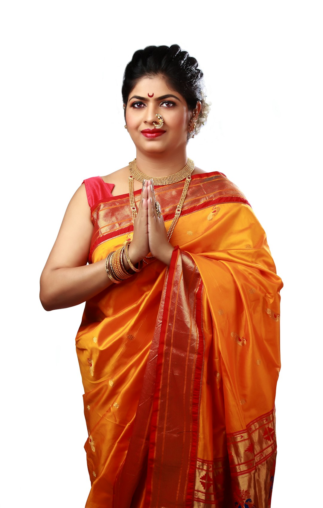Woman in an orange saree for a Hindi saree caption post