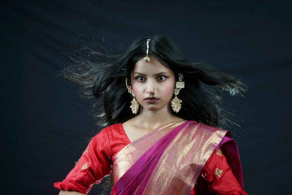 Woman in a red saree, saree captions in Hindi